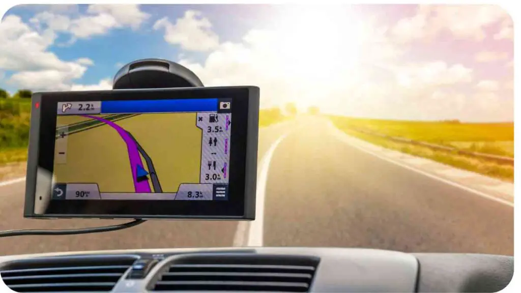 a gps device is mounted on the dashboard of a car on the road with the sun in the background