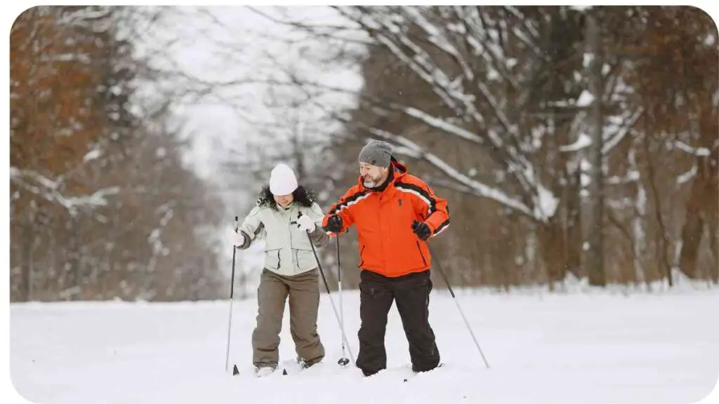 a man and a woman cross country skiing in the snow